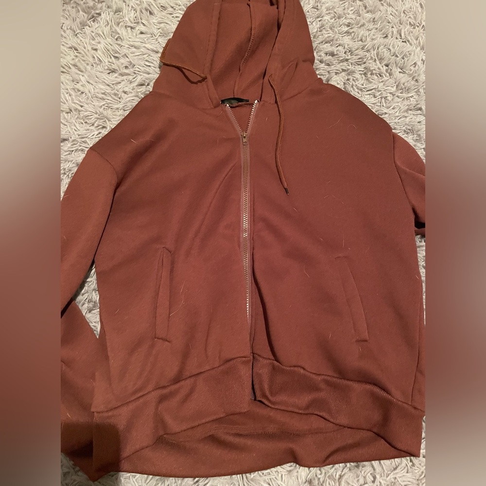 Zip up jacket with hood.